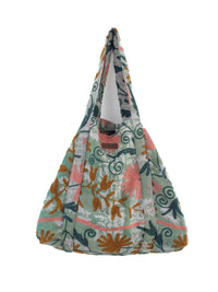 Vintage Suzani beach bag with embroidery in light green, dark green, pink and ochre, side view