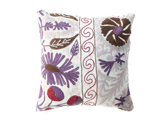 Unique suzani pillowcase 50x50 cm in light white with colorful purple and brown floral motifs and red ornamental border in oriental boho vintage style